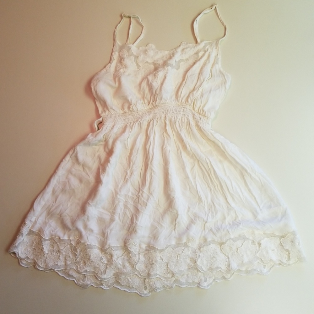 Off white tunic with floral lace.